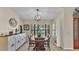 Dining room with decorative chandelier, cabinet and large window at 5819 Hollyhock Dr, Lakeland, FL 33813