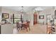 Bright dining room with stylish light fixture, ample natural light and tile flooring at 5819 Hollyhock Dr, Lakeland, FL 33813