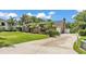 Beautiful home on a large lot with lush landscaping and an expansive driveway at 5819 Hollyhock Dr, Lakeland, FL 33813