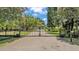 Private gated entrance to the home on a lovely tree-lined lot at 5819 Hollyhock Dr, Lakeland, FL 33813
