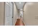 Hallway with wood floors and a view into an adjacent room at 5819 Hollyhock Dr, Lakeland, FL 33813