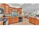Spacious kitchen featuring wood cabinets, granite countertops, and stainless steel appliances at 5819 Hollyhock Dr, Lakeland, FL 33813