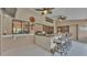 Backyard patio featuring a built-in kitchen, bar seating and a view into the backyard pool at 5819 Hollyhock Dr, Lakeland, FL 33813