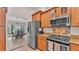 Well-equipped kitchen featuring stainless steel appliances and granite countertops at 5819 Hollyhock Dr, Lakeland, FL 33813