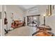 Living room with tile floors, piano, and sliding glass door to pool at 5819 Hollyhock Dr, Lakeland, FL 33813