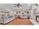 Large living room with wood floors and fireplace adjacent to the backyard pool at 5819 Hollyhock Dr, Lakeland, FL 33813