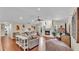Large living room featuring wood floors, fireplace, and a peaked ceiling at 5819 Hollyhock Dr, Lakeland, FL 33813