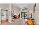 Living room with tile floors, piano, and door to bathroom at 5819 Hollyhock Dr, Lakeland, FL 33813