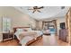 Cozy main bedroom with pool access and wood-look floors, perfect for relaxation at 5819 Hollyhock Dr, Lakeland, FL 33813
