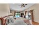 This is a well-lit main bedroom with wood floors and a walkout to the pool area at 5819 Hollyhock Dr, Lakeland, FL 33813