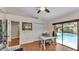 Office space that includes a desk with backyard pool views, creating a calm work environment at 5819 Hollyhock Dr, Lakeland, FL 33813