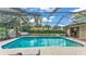 Sparkling screened-in pool with patio, lounge area, and access to the house at 5819 Hollyhock Dr, Lakeland, FL 33813