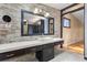 Modern bathroom with a stone accent wall, vessel sink, and sleek vanity at 6033 Mountain Lake Dr, Lakeland, FL 33813