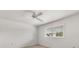 Empty bedroom with carpet flooring, window, and a ceiling fan at 6033 Mountain Lake Dr, Lakeland, FL 33813