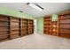 Bonus room with neutral carpet, shelves, and green walls at 6033 Mountain Lake Dr, Lakeland, FL 33813