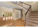 Inviting foyer showcasing hardwood floors, staircase, and a light-filled ambiance at 6033 Mountain Lake Dr, Lakeland, FL 33813