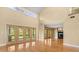 Bright and airy living space with hardwood floors, high ceilings, and large windows at 6033 Mountain Lake Dr, Lakeland, FL 33813