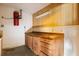 Practical workshop area with built-in cabinets, pegboard wall, and a central vacuum system at 6033 Mountain Lake Dr, Lakeland, FL 33813