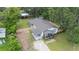 Aerial view of the property showcasing a spacious yard, covered parking and convenient access at 615 N Church Ave, Fort Meade, FL 33841
