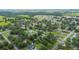 Wide aerial shot showcases the peaceful neighborhood and surrounding green spaces at 615 N Church Ave, Fort Meade, FL 33841