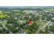Aerial view highlighting the property's location within a serene and green residential area at 615 N Church Ave, Fort Meade, FL 33841