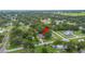 Aerial view showcases the home nestled in a tree-filled neighborhood at 615 N Church Ave, Fort Meade, FL 33841