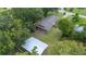 Birds-eye view of the property, with a covered patio and a large detached carport at 615 N Church Ave, Fort Meade, FL 33841