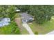 Aerial view of the property showcasing a spacious yard, covered parking and a welcoming porch at 615 N Church Ave, Fort Meade, FL 33841