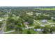 Expansive aerial view of the neighborhood with lush green trees and well-maintained lawns at 615 N Church Ave, Fort Meade, FL 33841