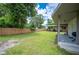 Expansive backyard showcasing a well-maintained lawn and ample space for outdoor activities at 615 N Church Ave, Fort Meade, FL 33841
