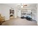 Bedroom featuring a bunk bed, closet, and ceiling fan with ample space for comfortable living at 615 N Church Ave, Fort Meade, FL 33841