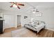 Comfortable bedroom features a ceiling fan, hardwood floors, and ample closet space at 615 N Church Ave, Fort Meade, FL 33841