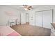 Charming bedroom with closet, a vanity and ceiling fan for comfortable and stylish living at 615 N Church Ave, Fort Meade, FL 33841