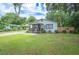 Charming single story home with well-manicured lawn at 615 N Church Ave, Fort Meade, FL 33841