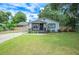 Charming single story home with well-manicured lawn and cozy front porch at 615 N Church Ave, Fort Meade, FL 33841