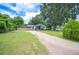 Charming single story home with well-manicured lawn and long driveway at 615 N Church Ave, Fort Meade, FL 33841