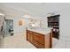 Kitchen island with stone countertops and custom cabinetry providing ample storage at 615 N Church Ave, Fort Meade, FL 33841