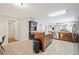 Open concept kitchen featuring a center island, breakfast bar, and stainless steel appliances at 615 N Church Ave, Fort Meade, FL 33841