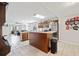 Spacious kitchen with a center island, breakfast bar, stainless steel appliances, and an open layout at 615 N Church Ave, Fort Meade, FL 33841