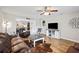 Inviting living room with hardwood floors, a ceiling fan, and an open layout at 615 N Church Ave, Fort Meade, FL 33841