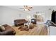 Inviting living room with hardwood floors, a ceiling fan, and an open layout at 615 N Church Ave, Fort Meade, FL 33841