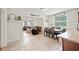 Open concept dining and living room area featuring wood and tile flooring at 615 N Church Ave, Fort Meade, FL 33841