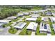 An elevated neighborhood shot of well-kept homes with pristine lawns and easy access to the community pool at 6443 Hollyberry Ne Ln, Winter Haven, FL 33881