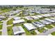 This high-angle shot displays charming homes with tidy yards and the neighborhood's refreshing swimming pool at 6443 Hollyberry Ne Ln, Winter Haven, FL 33881