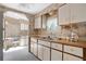 Efficient kitchen layout with wood countertops and white cabinetry at 6443 Hollyberry Ne Ln, Winter Haven, FL 33881