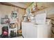 Laundry room with shelving, cleaning supplies and a washer and dryer at 6443 Hollyberry Ne Ln, Winter Haven, FL 33881