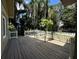 Inviting wooden deck with a white picket fence, perfect for outdoor dining and relaxation at 645 Avenue A Ne, Winter Haven, FL 33881