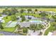 Picturesque aerial view of community amenities, pool, and pond at 6509 Oak Hammock Ct, Winter Haven, FL 33884