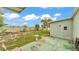The fenced-in backyard has a storage shed, patio, green grass and a bird bath at 6509 Oak Hammock Ct, Winter Haven, FL 33884