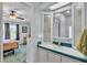 Bathroom vanity features decorative mirror, tiled counter, and view into bedroom at 6509 Oak Hammock Ct, Winter Haven, FL 33884
